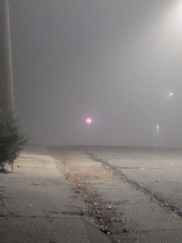 Lit APEX I Alpha Unit visible through dense fog from about 500 ft