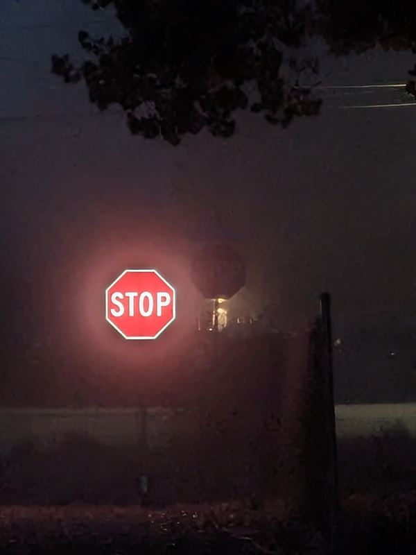 APEX I Alpha Unit STOP sign lit in heavy fog from about 100 ft